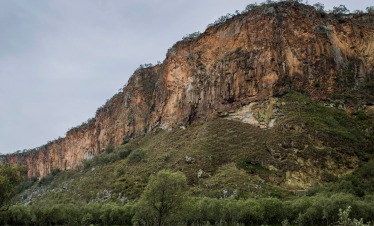 The towering cliffs and dramatic landscape within Hell's Gate National Park in Kenya