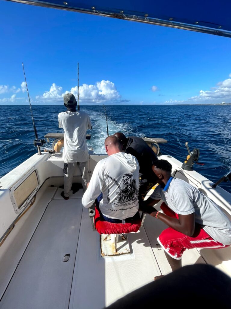 Setting sails and cleaning of equipment after deep sea fishing trip at Mtwapa