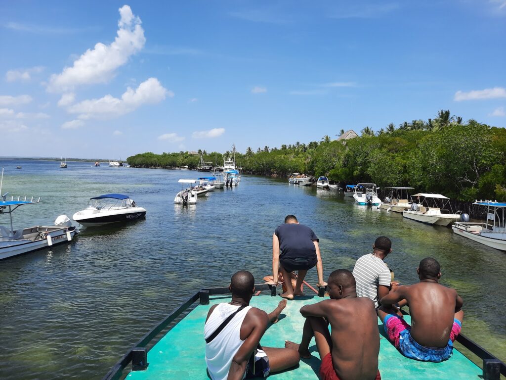 People chilling on a canoe at Sudi Iland Watamu