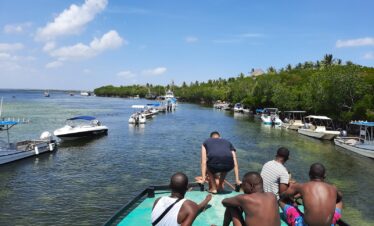 People chilling on a canoe at Sudi Iland Watamu